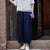 Pantalones sueltos de mujer de estilo chino con bordado floral y patrón de rayas