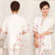 Chinesische Bluse aus Baumwolle mit Blumenstickerei und halben Ärmeln