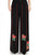 Pantalones sueltos de mujer de estilo chino con bordado floral y patrón de rayas