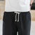 Leinen-Strandhose mit Blumendruck-Rand Lockere Hosen im chinesischen Stil Shorts