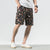 Strandhose aus Leinen mit Blumenmuster Lockere Hosen im chinesischen Stil Shorts