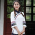 Camicia in stile cinese con ricami floreali e maniche alla coreana