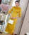 Abito Qipao di lunghezza del tè cheongsam moderno con maniche a 3/4 con ricamo scavato