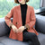 Cappotto per madre in maglia stile cinese con scollo a V e orlo asimmetrico
