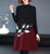 Abito con base in maglia floreale a trapezio con collo alto e lunghezza al ginocchio