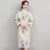 Col en fourrure et poignets en brocart floral Cheongsam longueur au genou ouaté robe chinoise