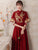 Orientalisches Abendkleid aus Samt mit Vogel- und Blumenstickerei und französischer Manschette
