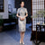 Robe chinoise traditionnelle Cheongsam à manches courtes et motif géométrique