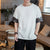 Camiseta china de algodón con cuello redondo y puños brocados