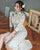 Robe chinoise Cheongsam moderne à motif de feuilles avec jupe plissée