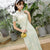 Vestido chino de longitud completa de Cheongsam de encaje floral con cuello de ilusión