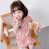 Vestido cheongsam infantil de algodón floral con cuello mandarín y mangas casquillo