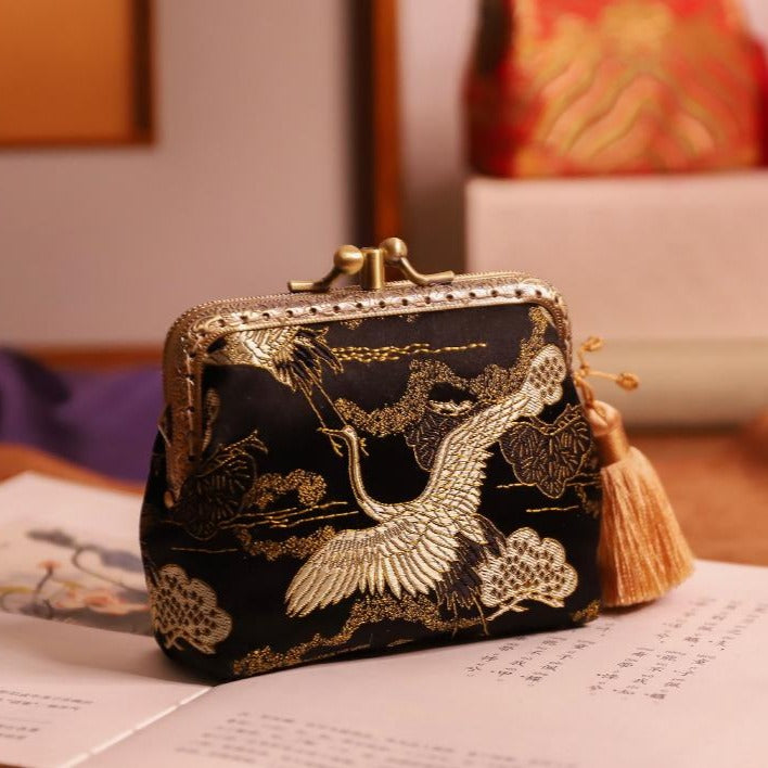 Bag in a rectangular model with flap, from green yellow brocade with a  pattern of flowers and birds, equipped with a fair and mirror. Bag in a  rectangular reinforced model with flap,