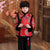 Traje acolchado de niño de estilo chino con borde de piel de brocado de patrón auspicioso