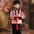 Traje acolchado de niño de estilo chino tradicional con cuello de piel de brocado con patrón de grúa