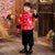 Abito imbottito da ragazzo in stile tradizionale cinese con motivo a drago broccato con bordo in pelliccia