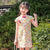 Vestido chino cheongsam para niños con patrón de abanicos orientales