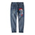 Pantalon droit en jean style oriental avec broderie carpe