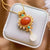 Corallo rosso con perle e collana dorata con ciondolo turchese