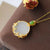 Vergoldete Halskette mit weißem Jade-Anhänger in Spiegelform