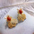 Orecchini dorati in stile cinese con agata rossa a forma di pesce rosso