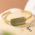 Braccialetto dorato in stile cinese con perline di giada verde
