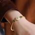 Vergoldenes Fu-Charakter-Armband aus weißer Jade im chinesischen Stil