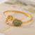Bracelet en dorure de style chinois avec perle de jade en forme de gourde
