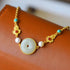 Braccialetto di doratura in stile cinese con perle di corallo rosso di giada e perle di turchese