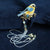 Stickerei in Vogelform mit Quastenvergoldung Brosche