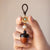 Sandalwood Acorn Car Key Pendant with Crystals in It